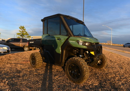 2024 Can-Am Defender DPS CAB HD9. Photograph shows the 2025 model.